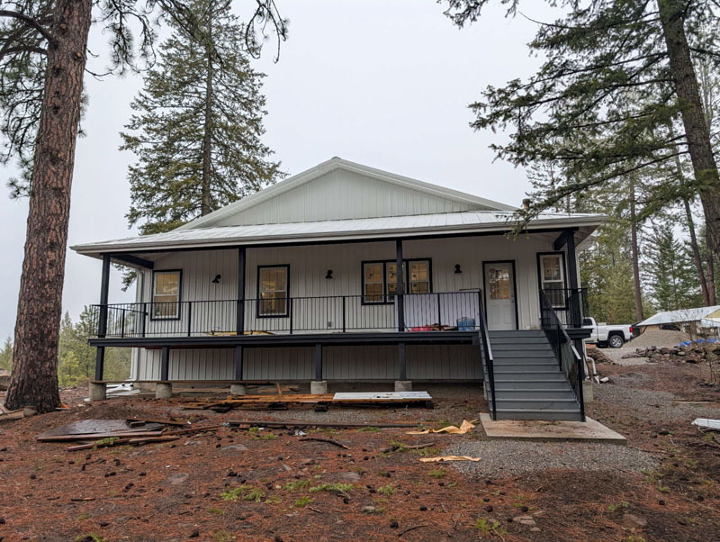 Home addition with covered porch in Northern Idaho