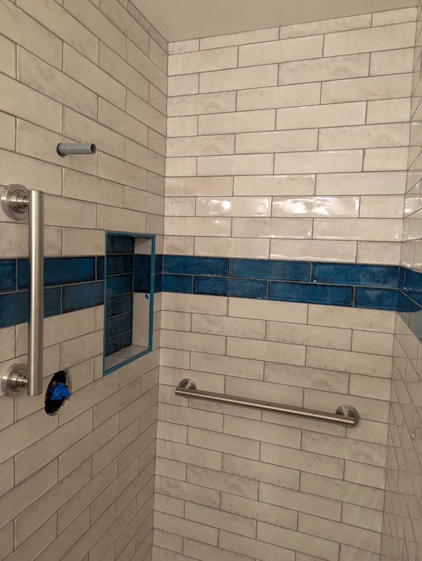 Subway tile shower with accent band